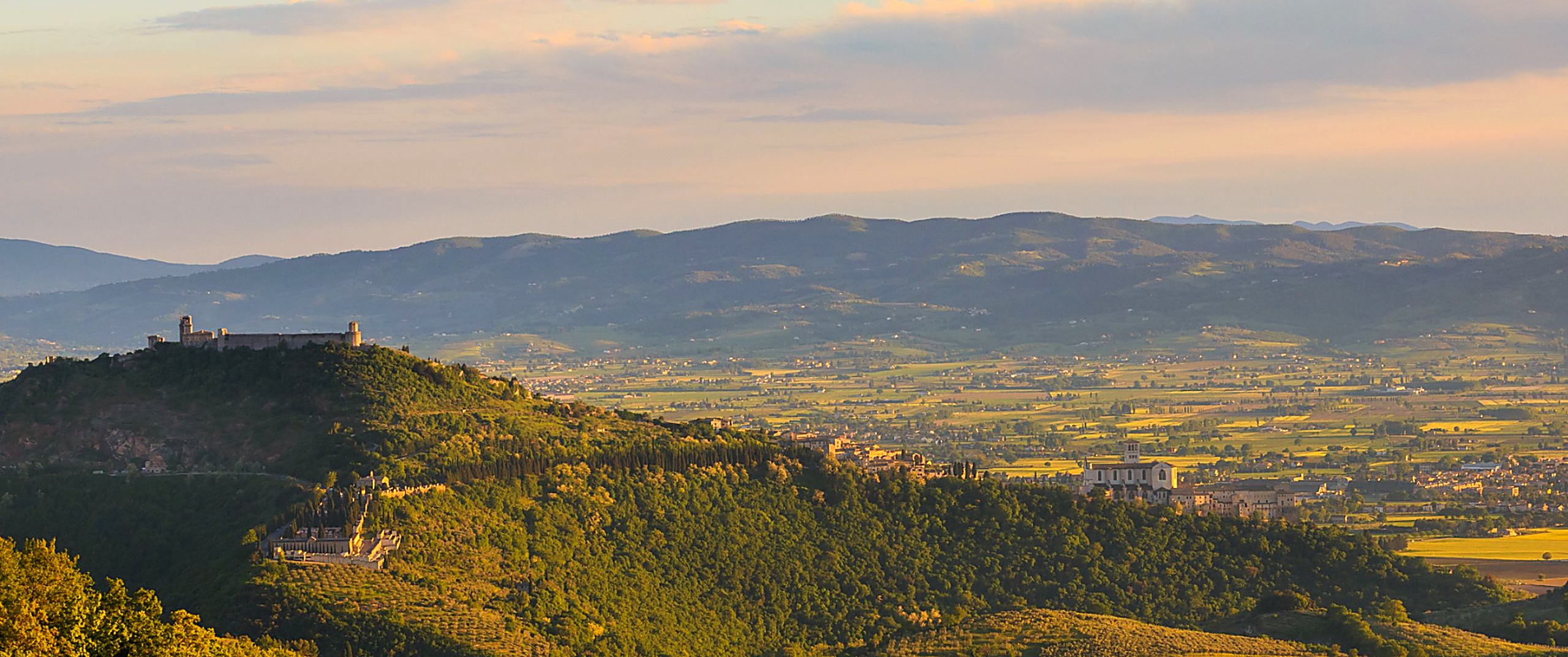 The Umbrian valley below Assisi at golden hour